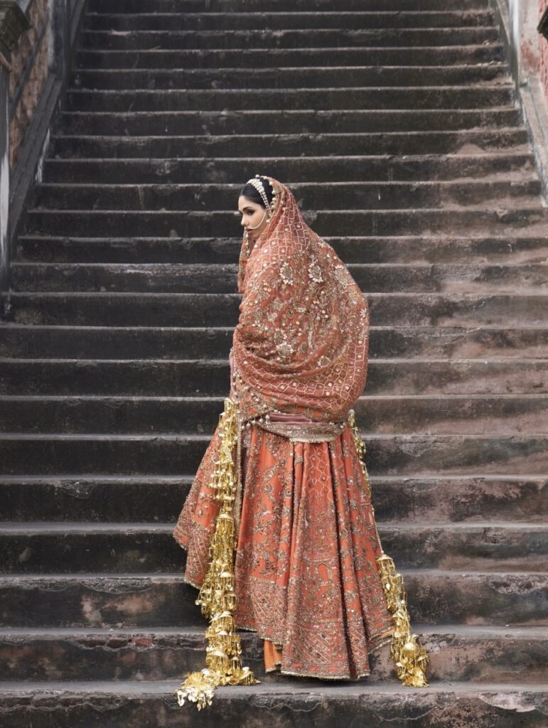 Rust orange lehenga from kORA COLLECTION 2026 BY AKRITI RITIKA