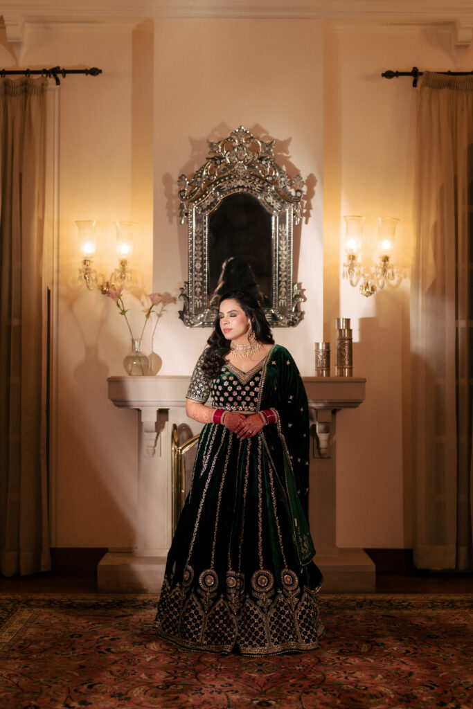 Punjabi bride in emerald green lehenga on her reception