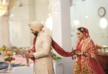 The Modern Punjabi Groom: A Guide to Groom Wedding Style Modern Punjabi groom wearing a traditional safa and wedding sherwani